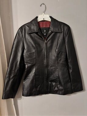 Women's Black Leather Zip-Up Jacket with Structured Seams
